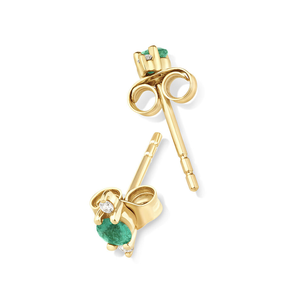 3 Stone Emerald Earrings with .04 Carat TW Diamonds in 10kt Yellow Gold