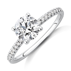 1.14 Carat TW of Diamonds Engagement Ring with a 1 Carat Round Centre Laboratory-Created Diamond and shouldered by 0.14 Carat TW of Natural Diamonds in 14kt White Gold