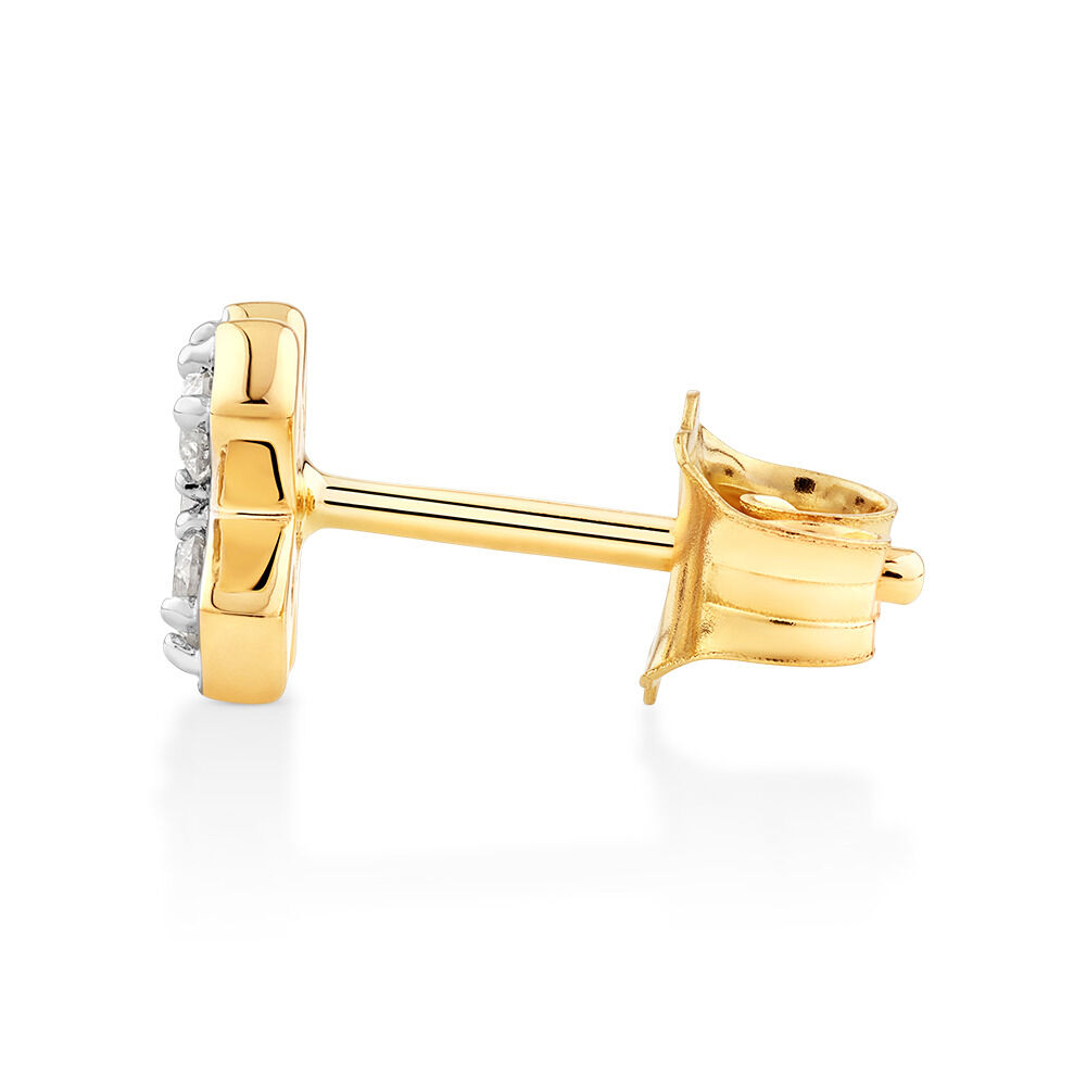 Bouton d'oreille en forme de croix en or jaune 10 K à diamants totalisant 0,10 ct