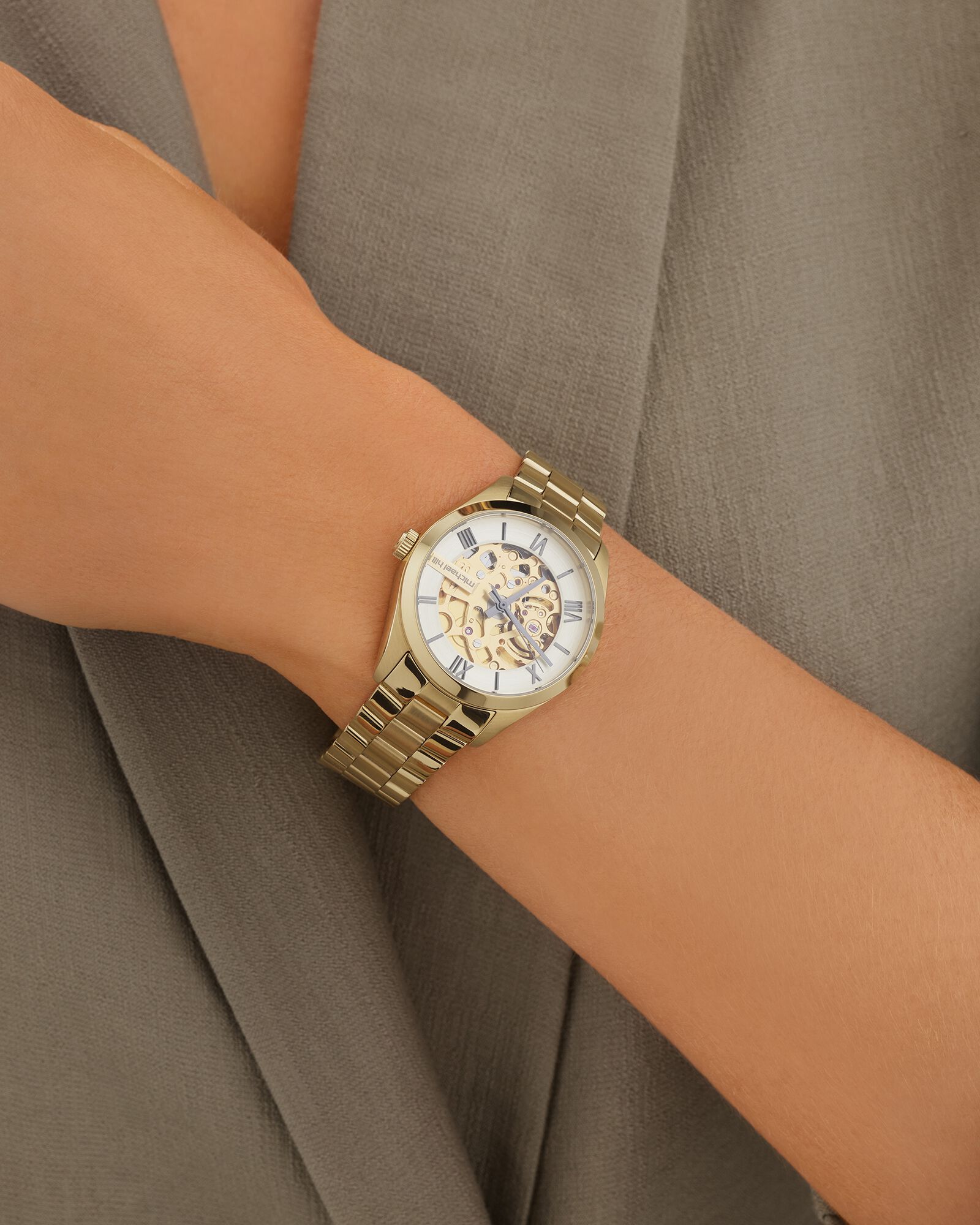 Women s Automatic Skeleton Watch In Gold Tone Stainless Steel
