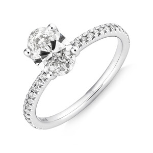 Engagement Ring with 1.14 Carat TW of Diamonds. A 1 Carat Oval Centre Laboratory-Created Diamond and shouldered by 0.14 Carat TW of Natural Diamonds in 14kt White Gold