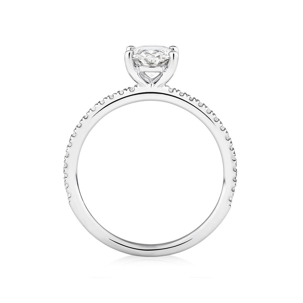 Engagement Ring with 1.14 Carat TW of Diamonds. A 1 Carat Oval Centre Laboratory-Created Diamond and shouldered by 0.14 Carat TW of Natural Diamonds in 14kt White Gold
