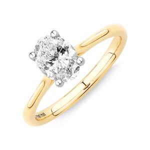 1.00 Carat TW Oval Solitaire Engagement Ring in 14kt Yellow and White Gold
