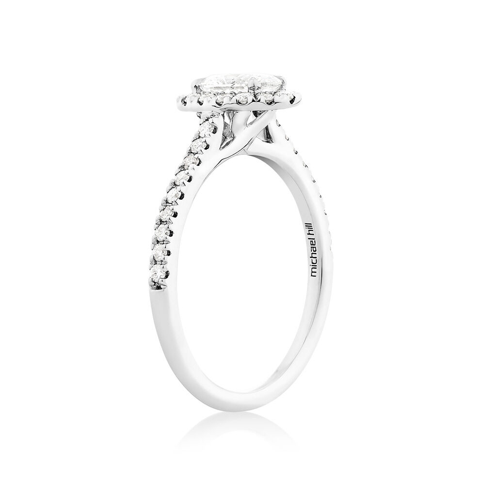Halo Oval Engagement Ring with 0.92 Carat TW of Diamonds in 14kt White Gold