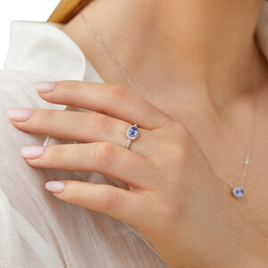Halo Ring with Tanzanite & 0.15 Carat TW Of Diamonds in 10kt White Gold