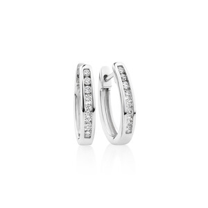 Oval Huggie Earrings with 0.25 Carat TW of Diamonds in 10kt White Gold
