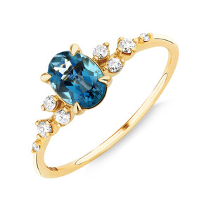 Ring with Blue Topaz and 0.12 Carat TW of Diamonds in 10kt Yellow Gold