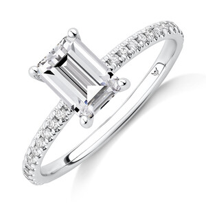 Engagement Ring with 1.14 Carat TW of Diamonds. A 1 Carat Emerald Cut Centre Laboratory-Grown Diamond and shouldered by 0.14 Carat TW of Natural Diamonds in 14kt White Gold