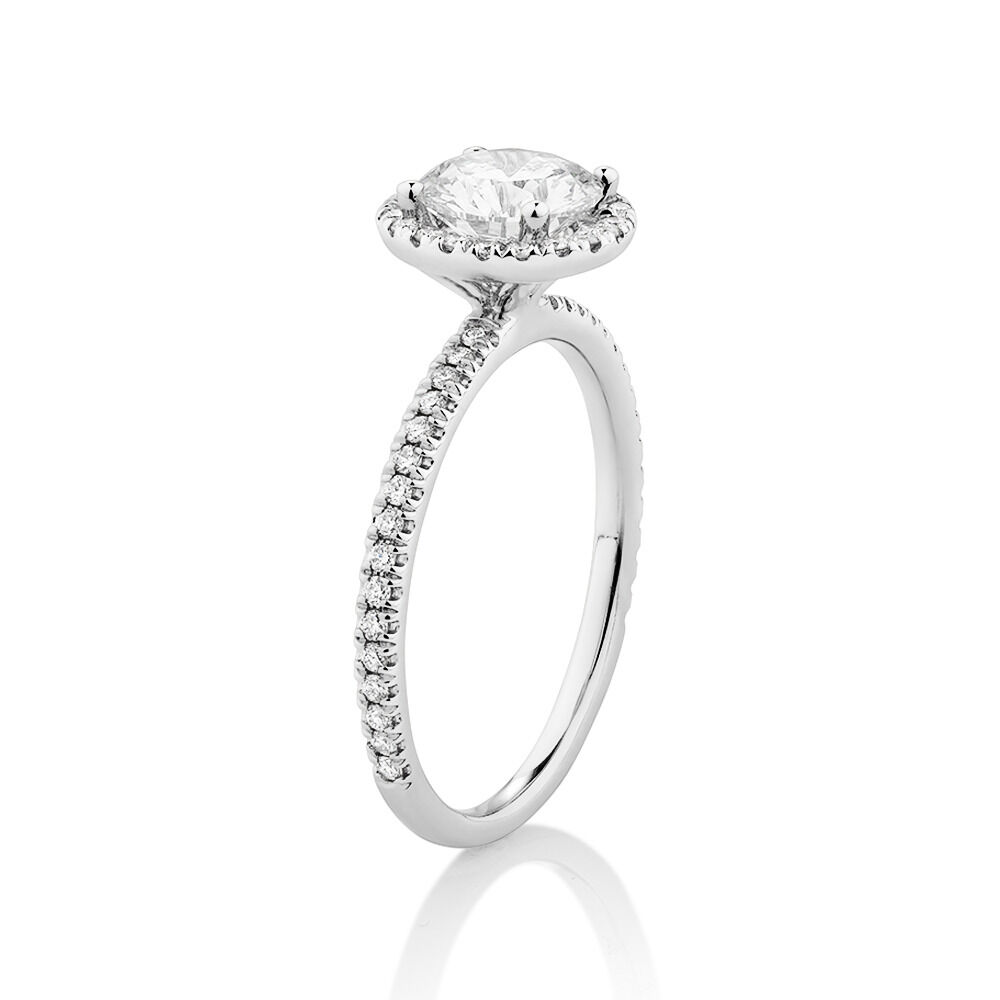Halo Engagement Ring with 1.23 Carat TW of Diamonds. A 1 Carat Round Brilliant Laboratory-Created Centre Diamond and 0.23 Carat TW of Natural Diamonds in the Shoulders and Halo in 14kt White Gold