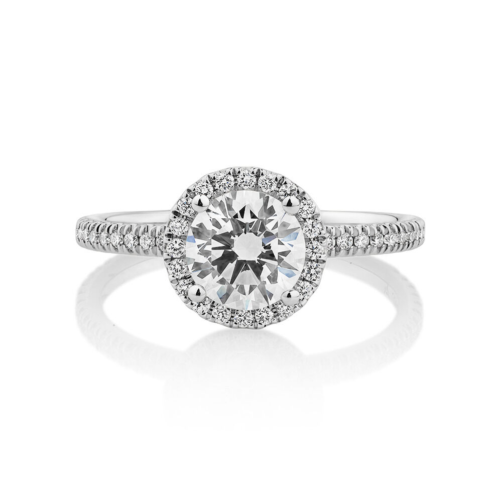 Halo Engagement Ring with 1.23 Carat TW of Diamonds. A 1 Carat Round Brilliant Laboratory-Grown Centre Diamond and 0.23 Carat TW of Natural Diamonds in the Shoulders and Halo in 14kt White Gold